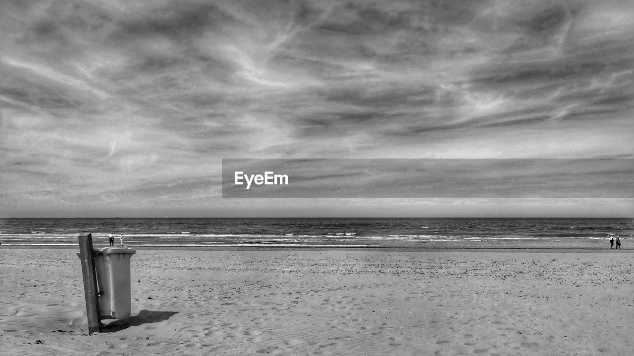 SCENIC VIEW OF SANDY BEACH AGAINST SKY