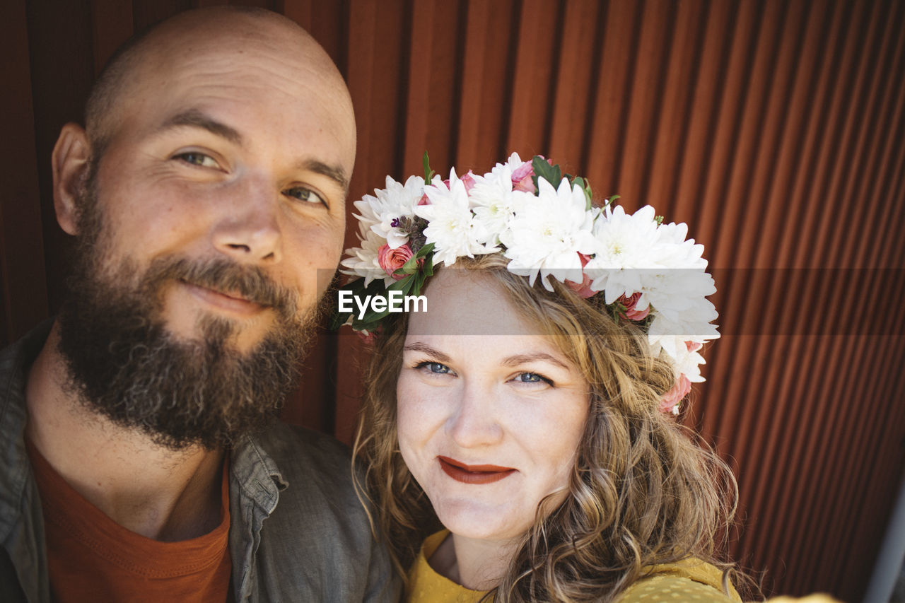 Portrait of smiling couple looking at camera