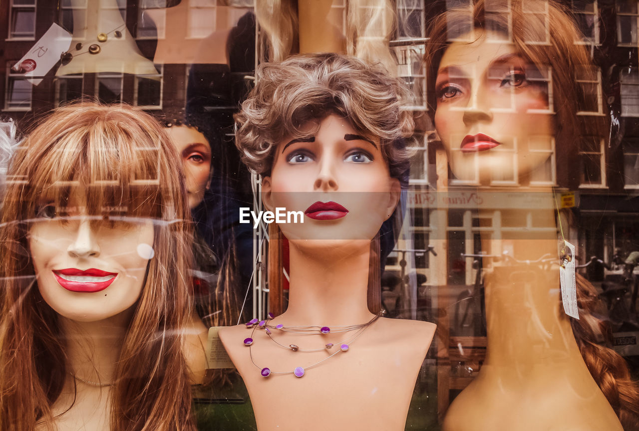Close-up of mannequins in display at store
