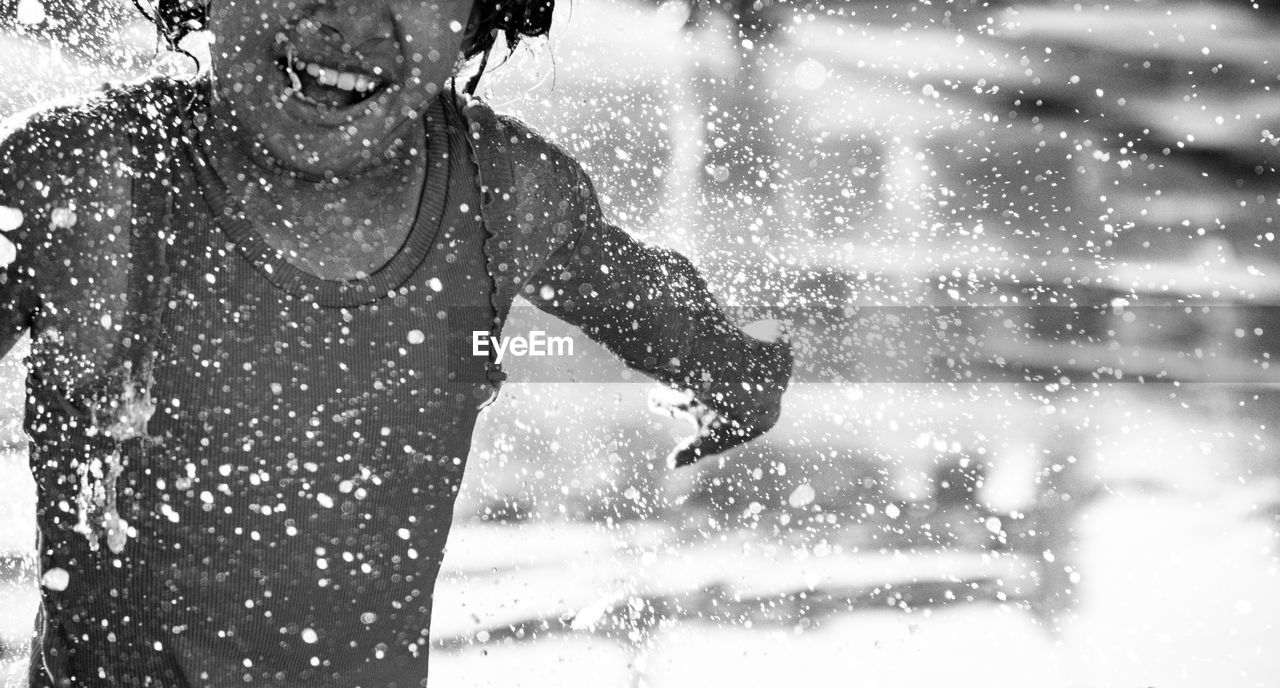 BLURRED MOTION OF WOMAN RUNNING AT WATER