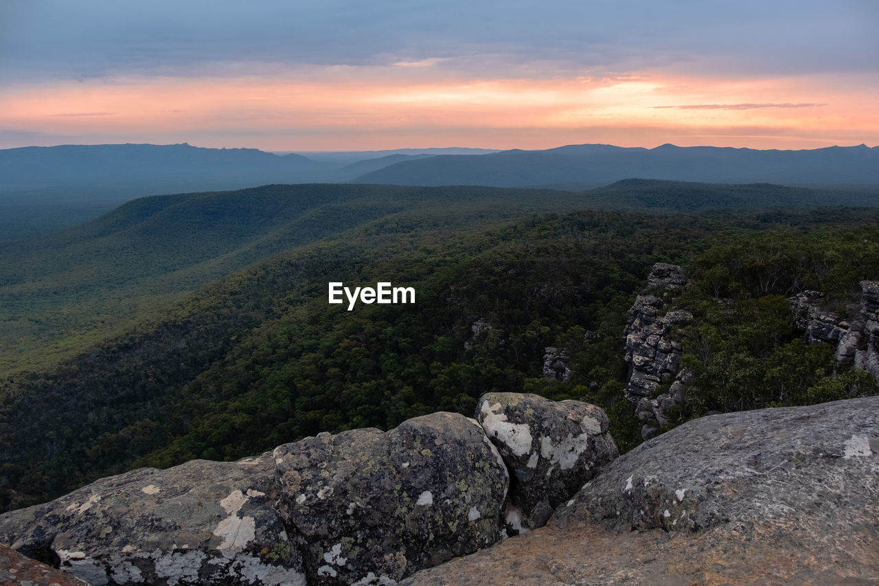 Scenic view of landscape against sky during sunset