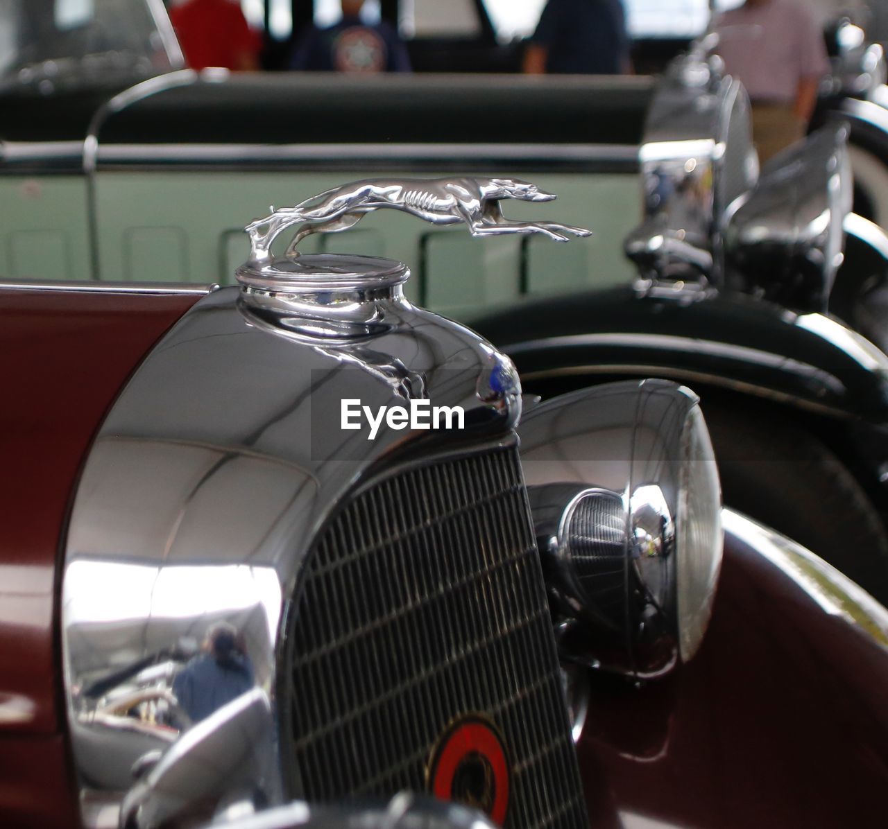 CLOSE-UP OF VINTAGE CAR ON MIRROR