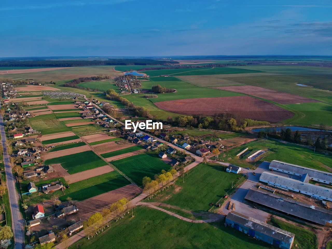 HIGH ANGLE VIEW OF AGRICULTURAL LANDSCAPE