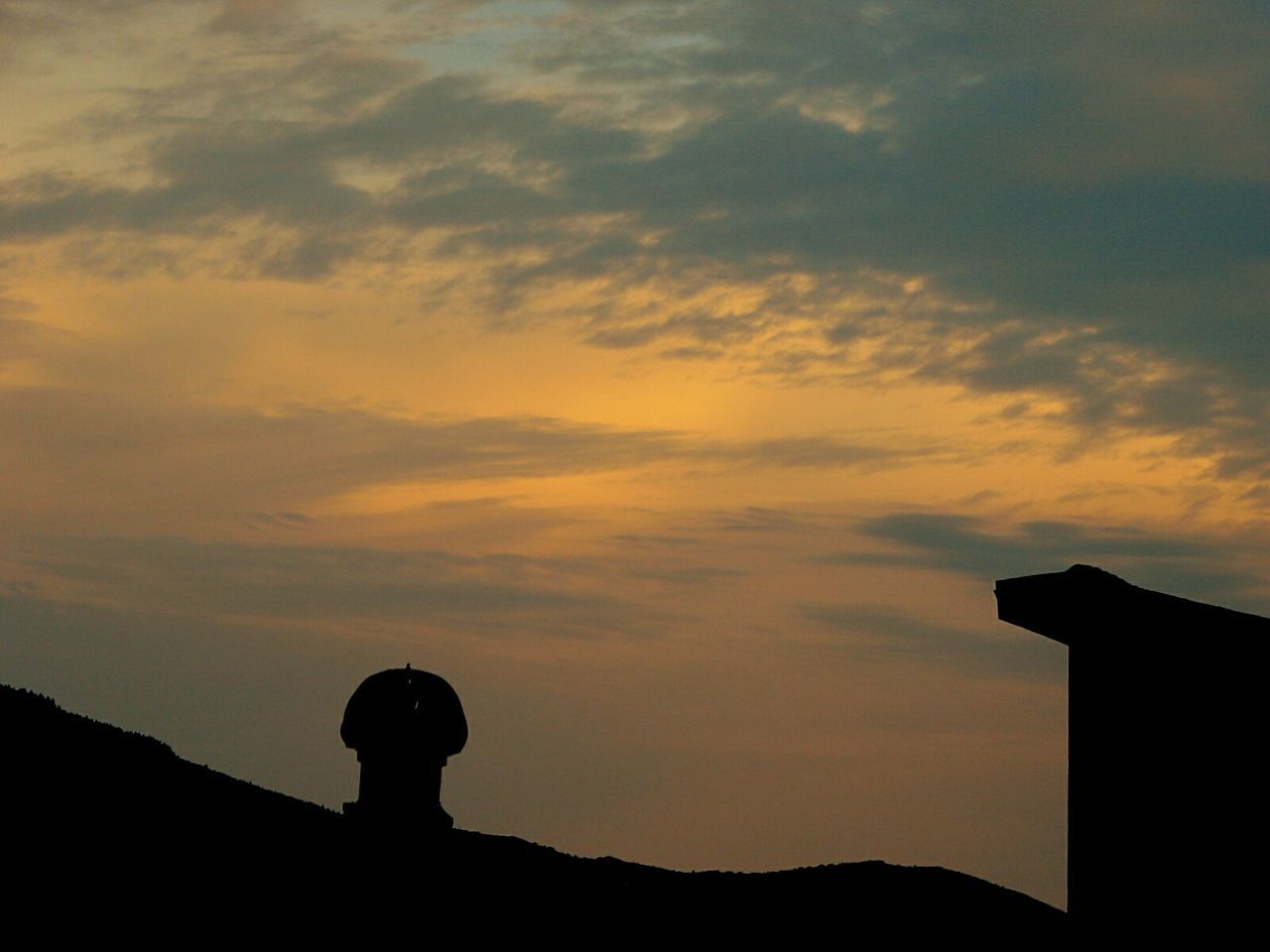LOW ANGLE VIEW OF SILHOUETTE PERSON AGAINST SKY