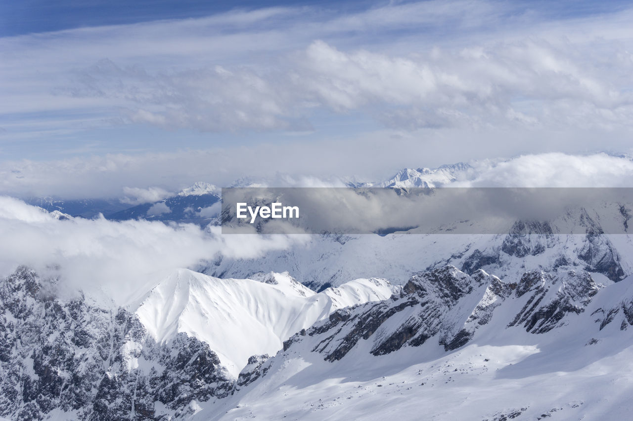 Scenic view of snowcapped mountains against sky