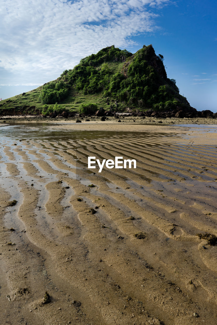SURFACE LEVEL OF SHORE AGAINST SKY