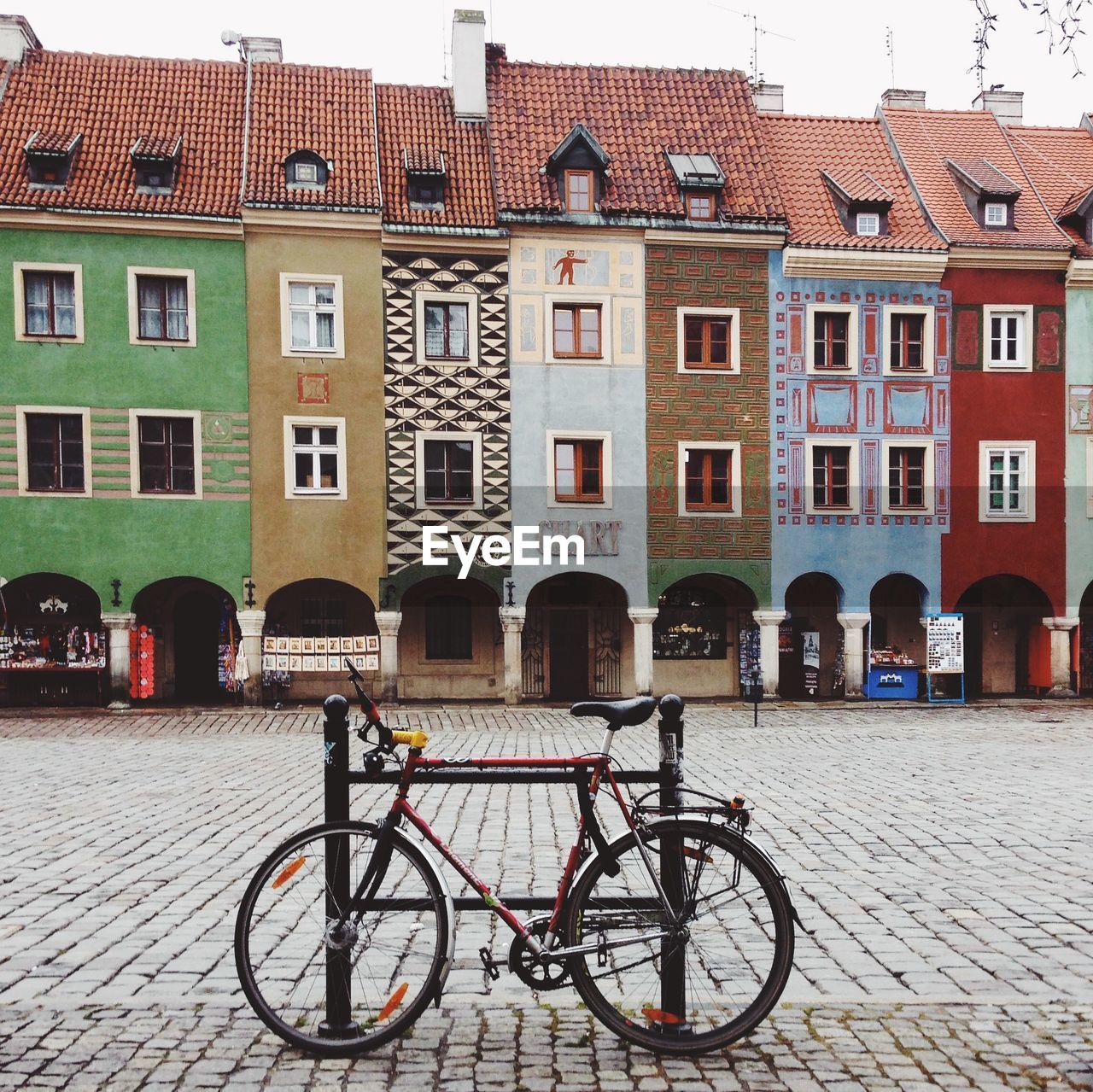 Bicycle parked in courtyard of building