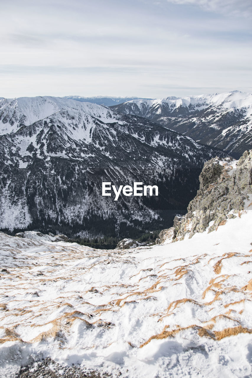 Scenic view of snowcapped mountains against sky