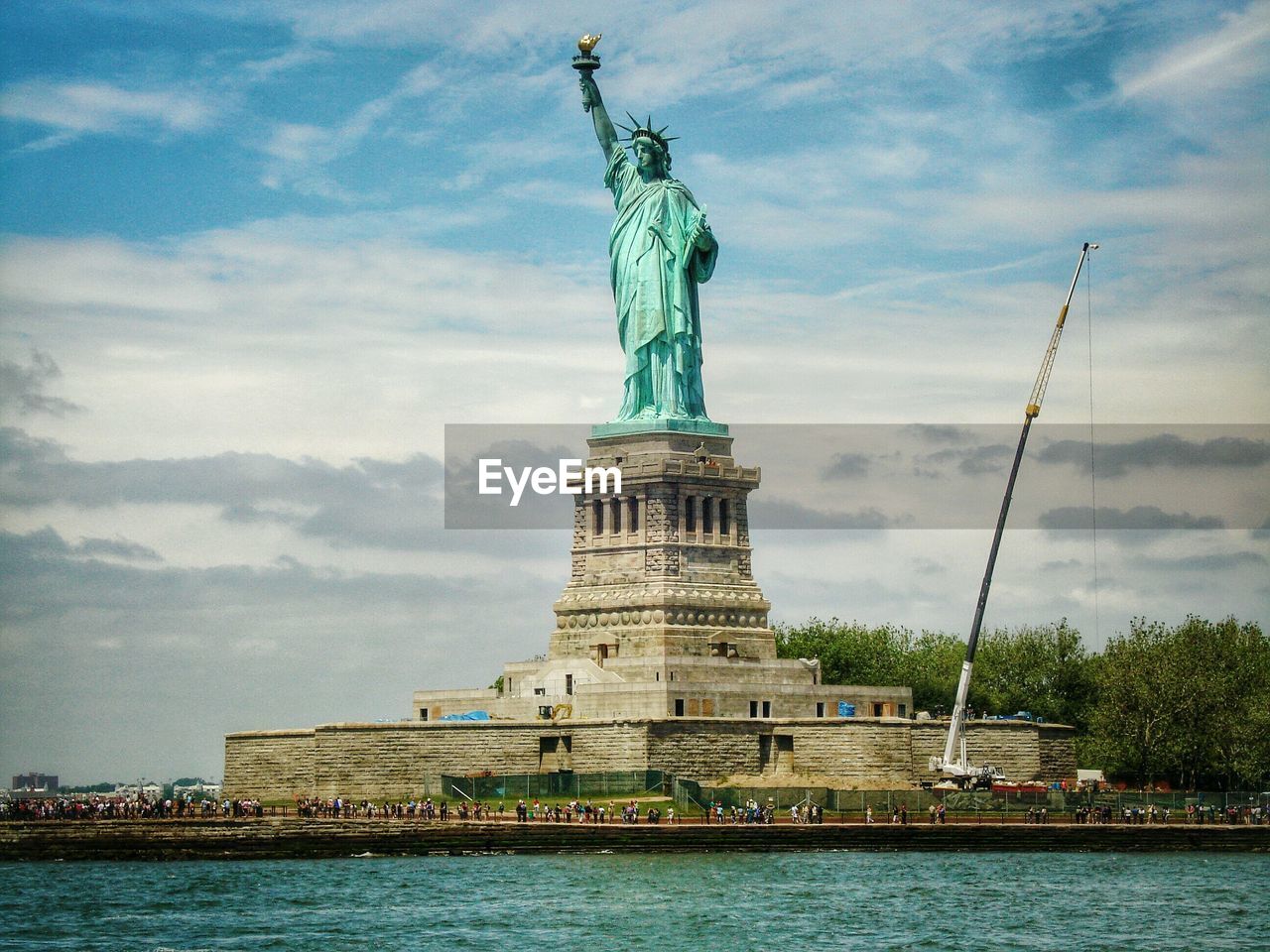 Statue of liberty against cloudy sky