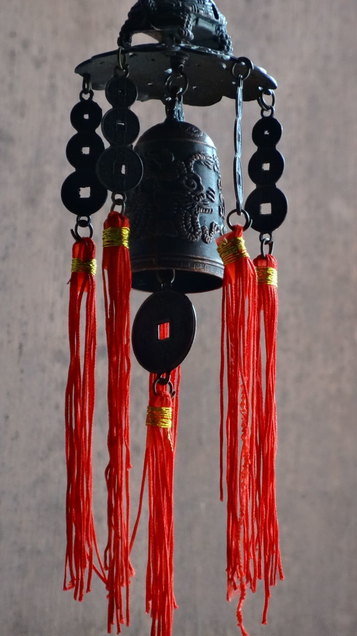 CLOSE-UP OF ICE CREAM HANGING FROM ROW