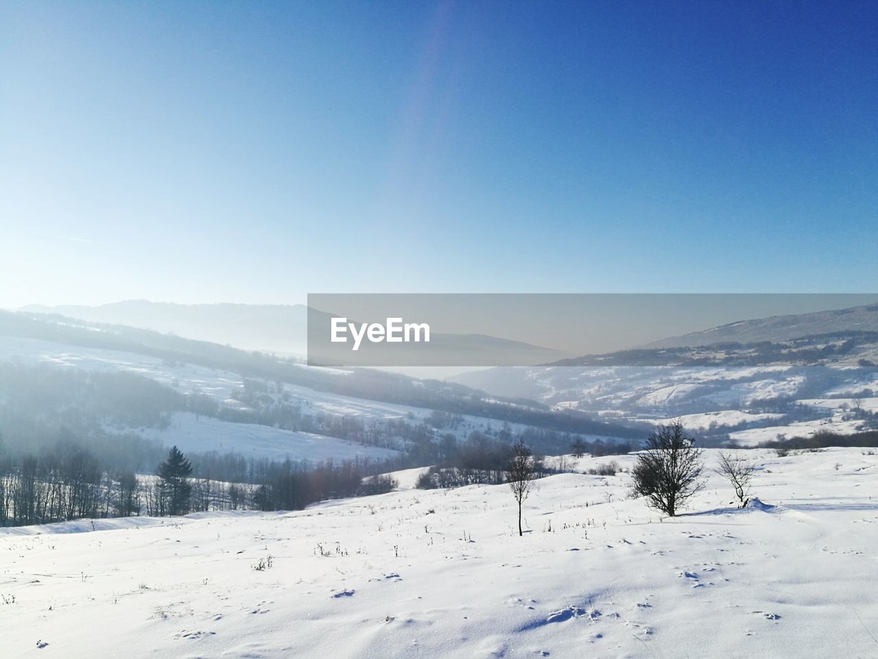 SCENIC VIEW OF MOUNTAINS AGAINST CLEAR SKY