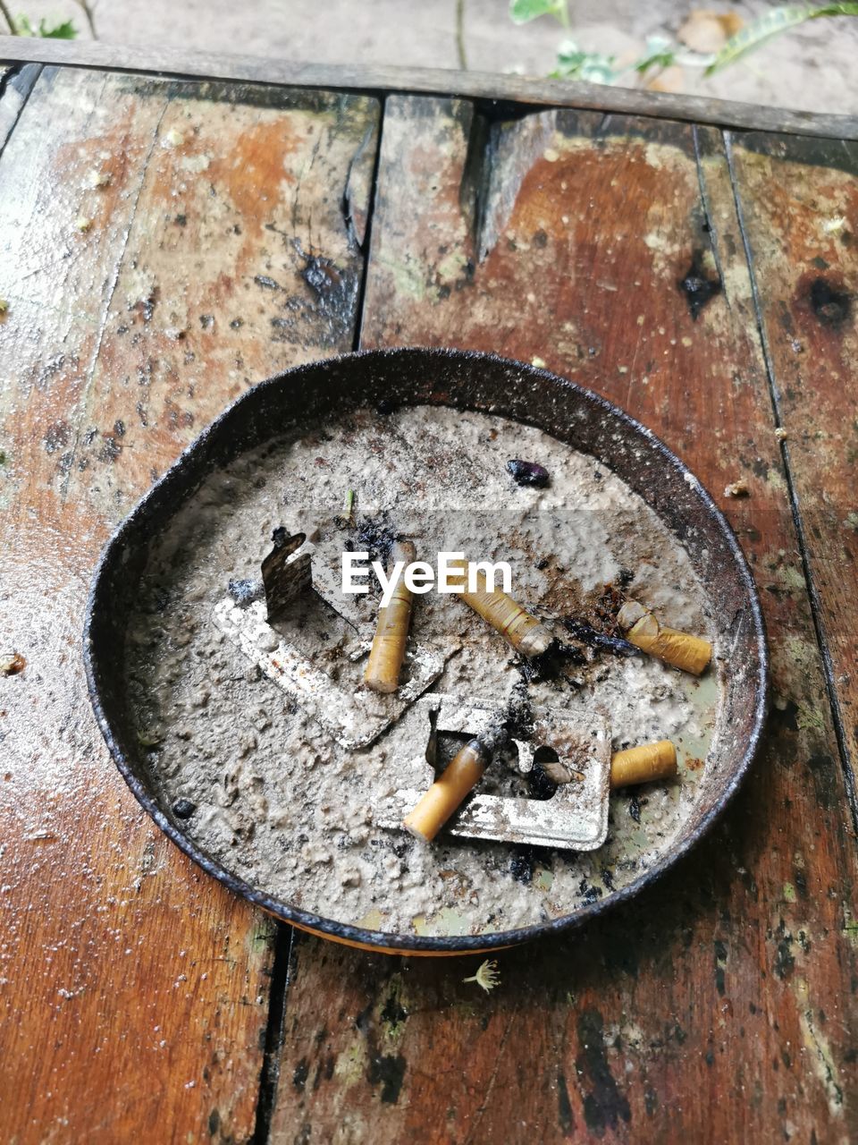 cigarette, cigarette butt, ashtray, smoking issues, bad habit, no people, wood, high angle view, communication, sign, warning sign, close-up, day, iron, metal, burnt, social issues, art