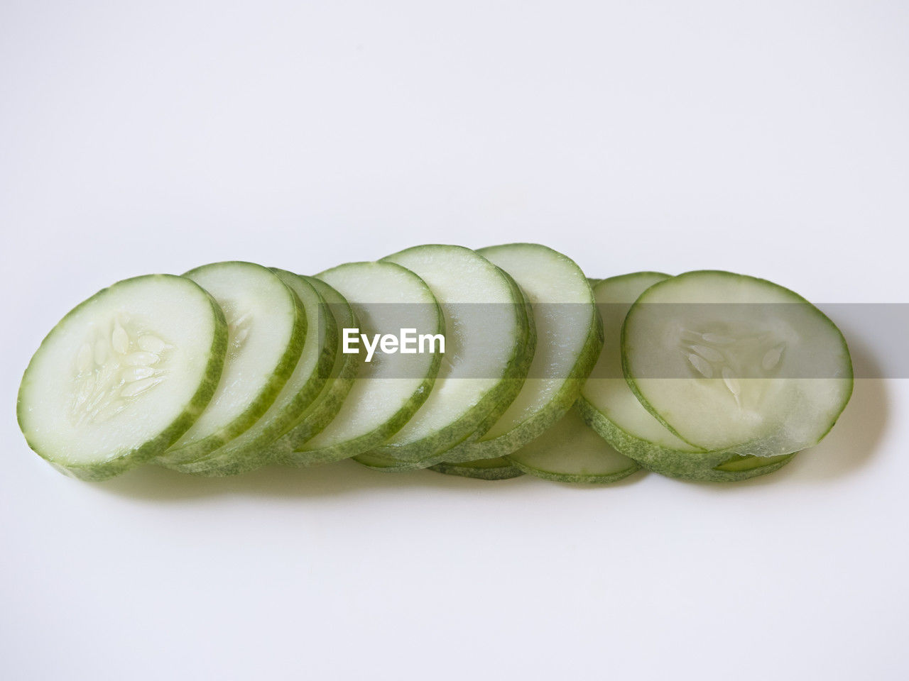 cucumber, food and drink, food, healthy eating, freshness, wellbeing, vegetable, studio shot, produce, indoors, slice, white background, zucchini, no people, cut out, plant, green, fruit, cross section, still life, raw food, close-up, group of objects, organic
