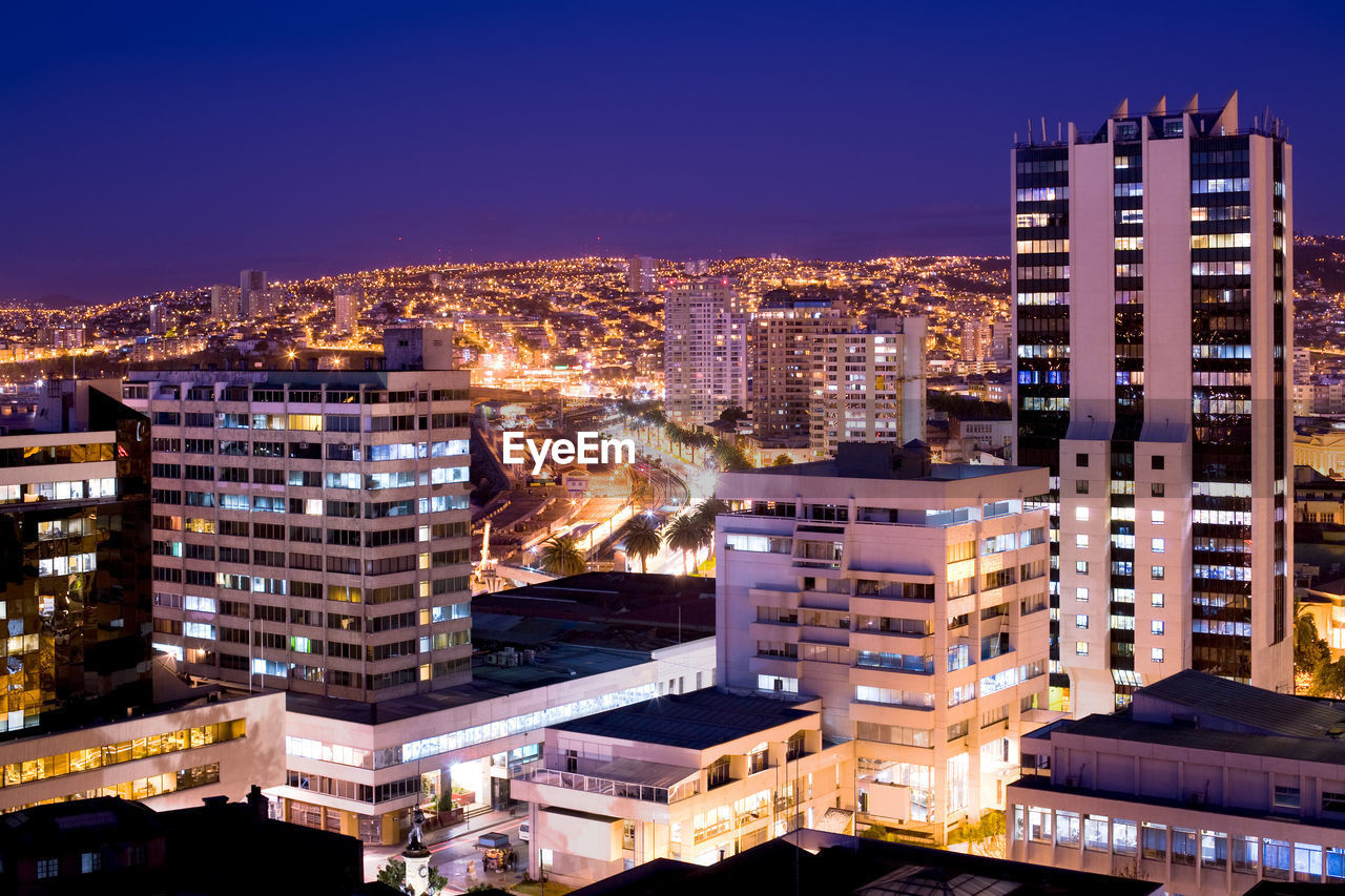 High angle view of illuminated cityscape at night