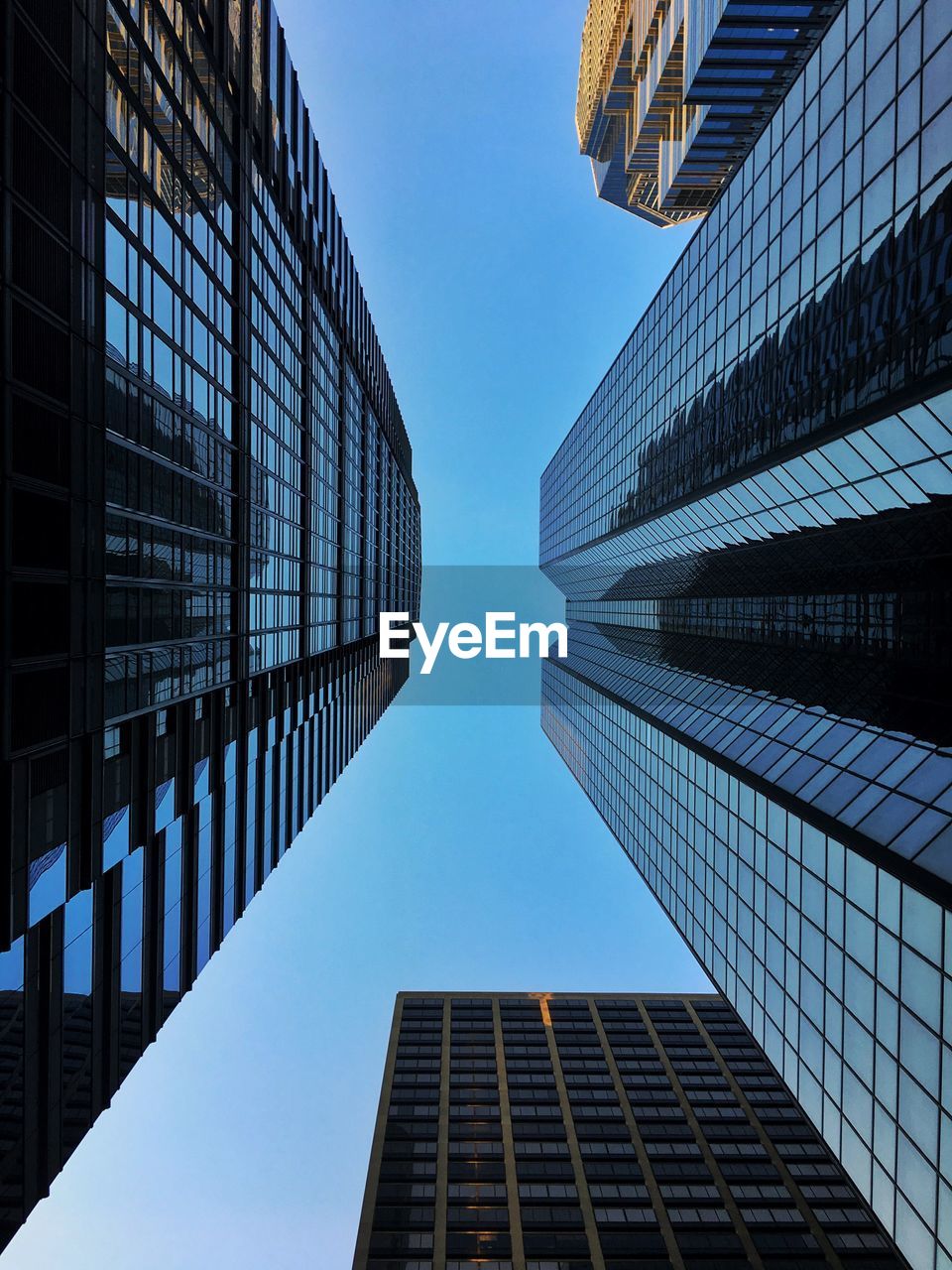 Low angle view of modern buildings against clear sky