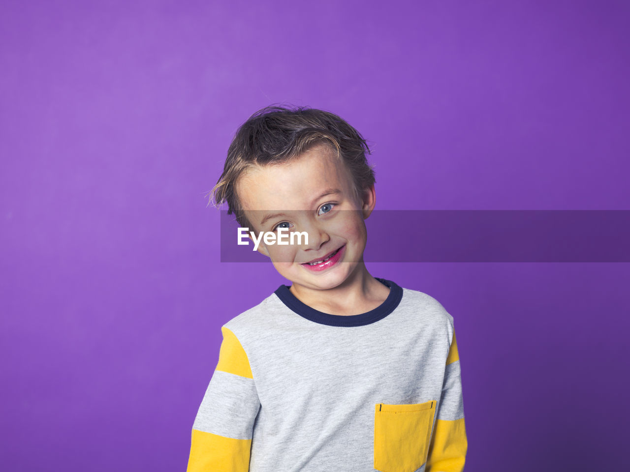 Boy against purple background