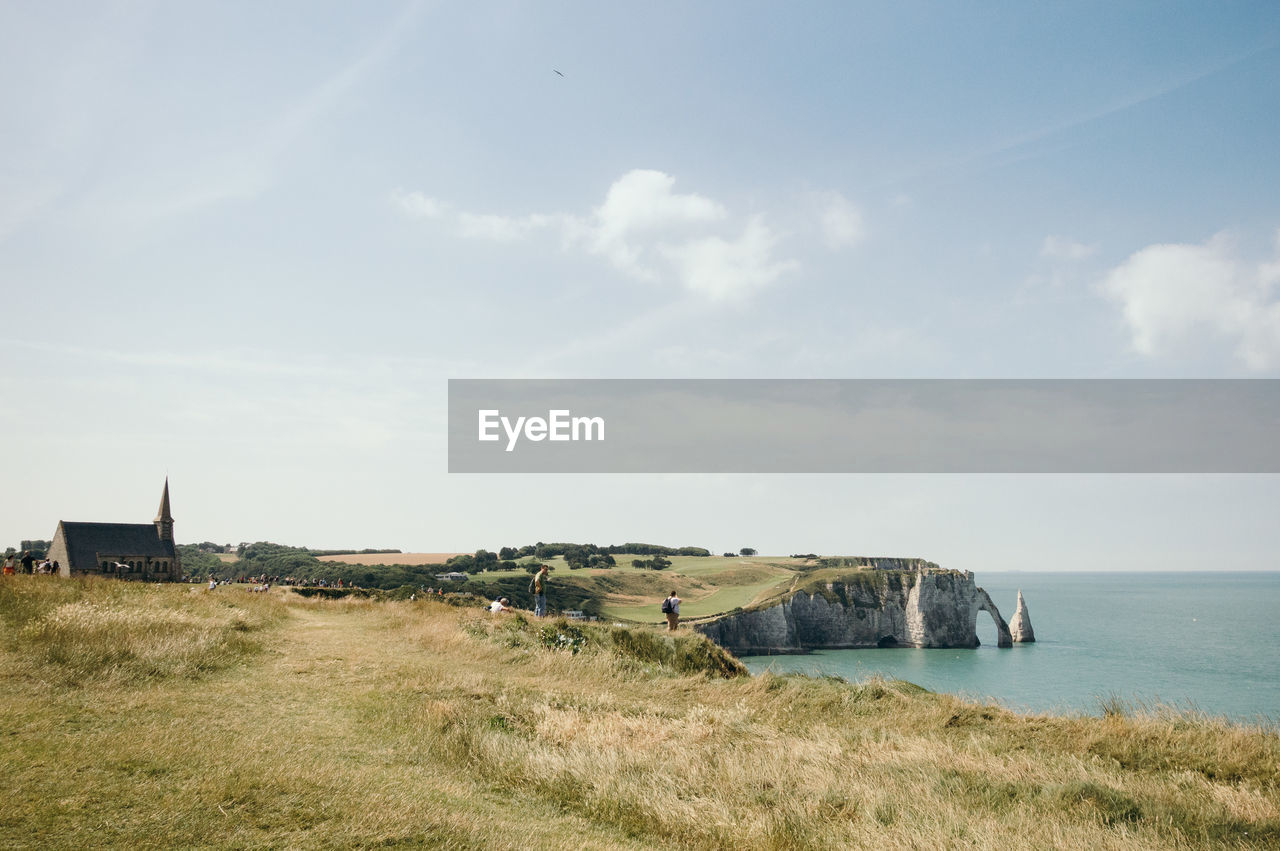 High angle view of cliff by sea at etretat