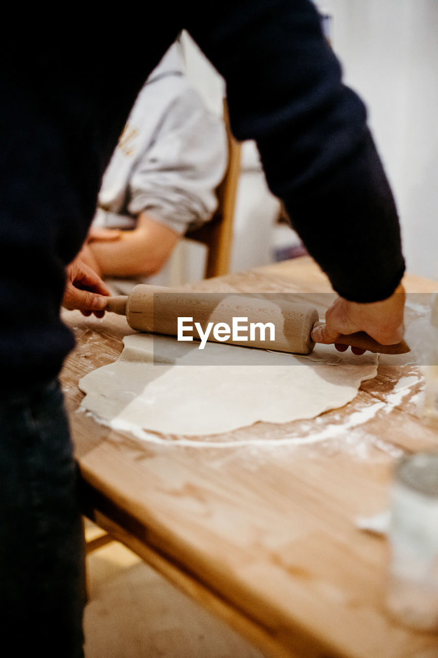 Midsection of person preparing food