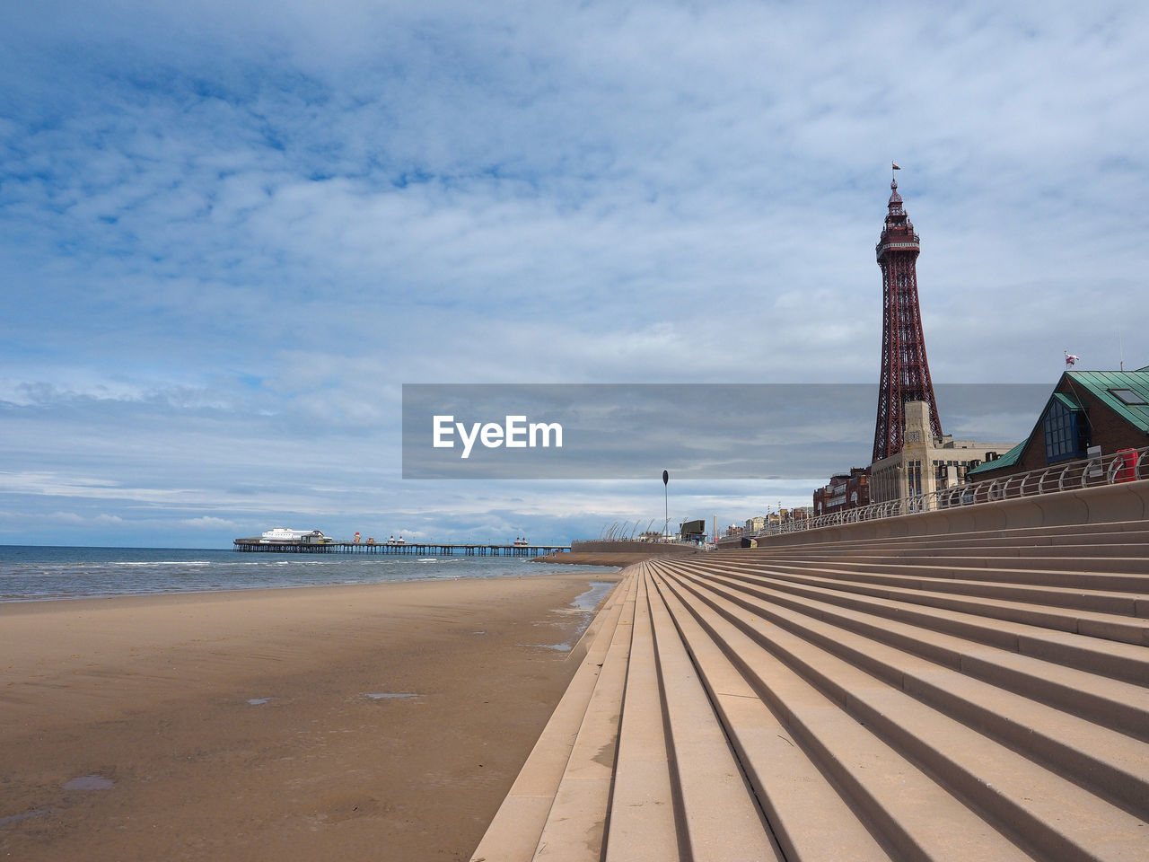 View of beach and buildings against sky