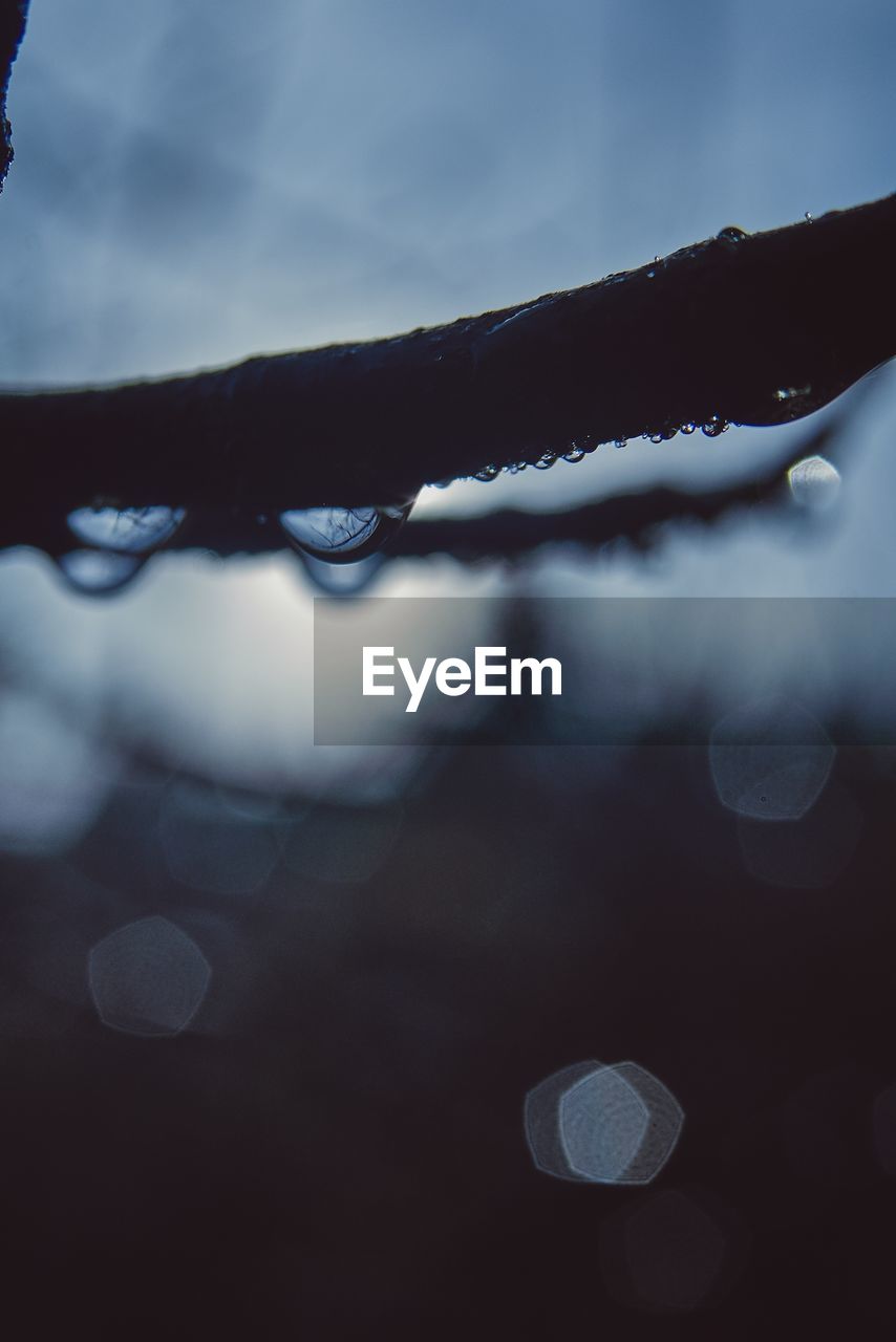 CLOSE-UP OF SNOW AGAINST SKY DURING WINTER