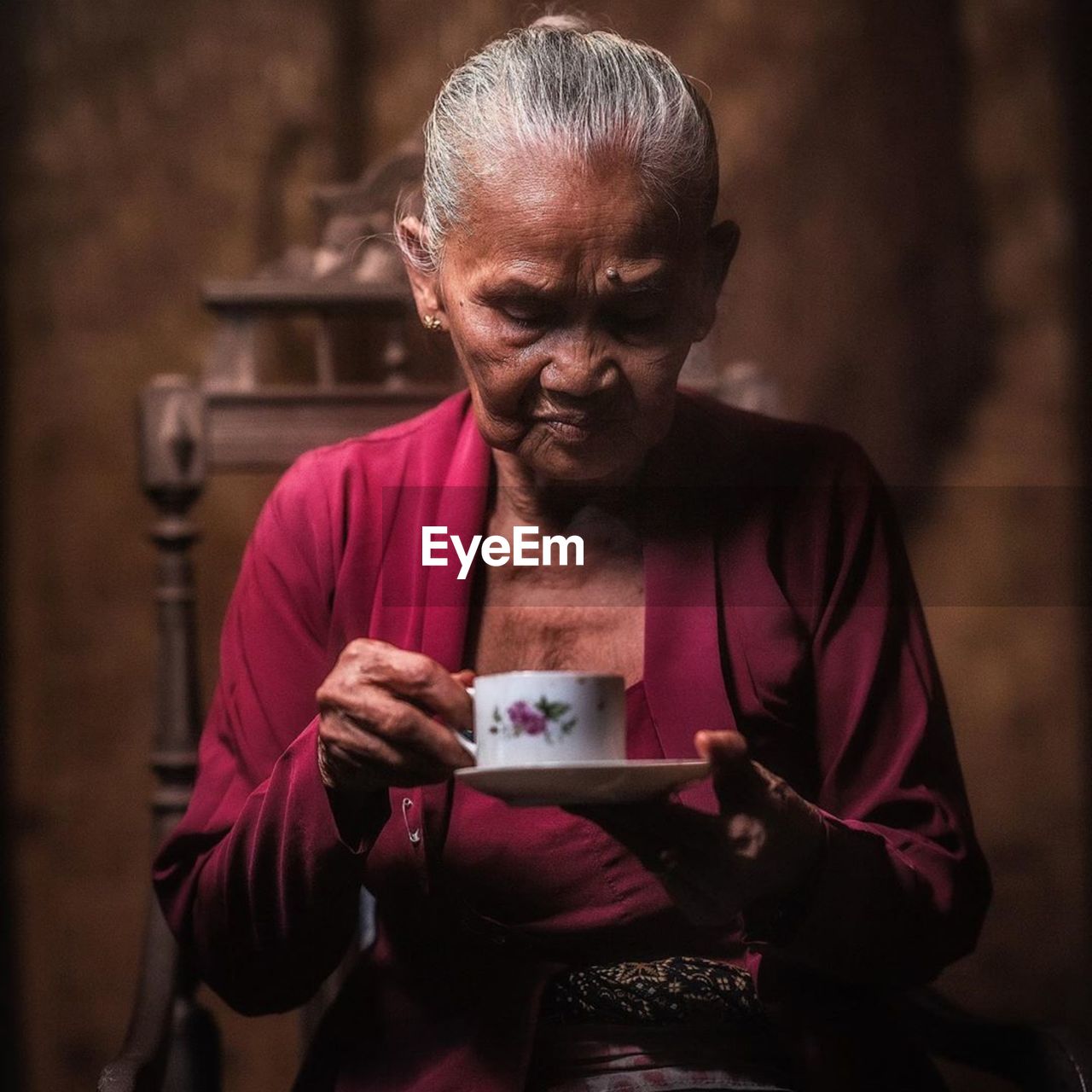 Senior woman having tea