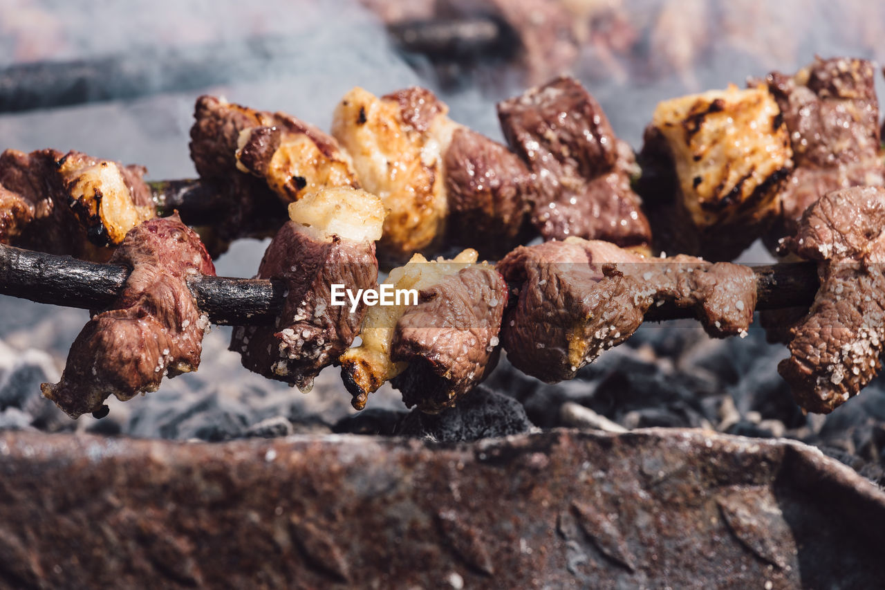 Close-up of meat on grill