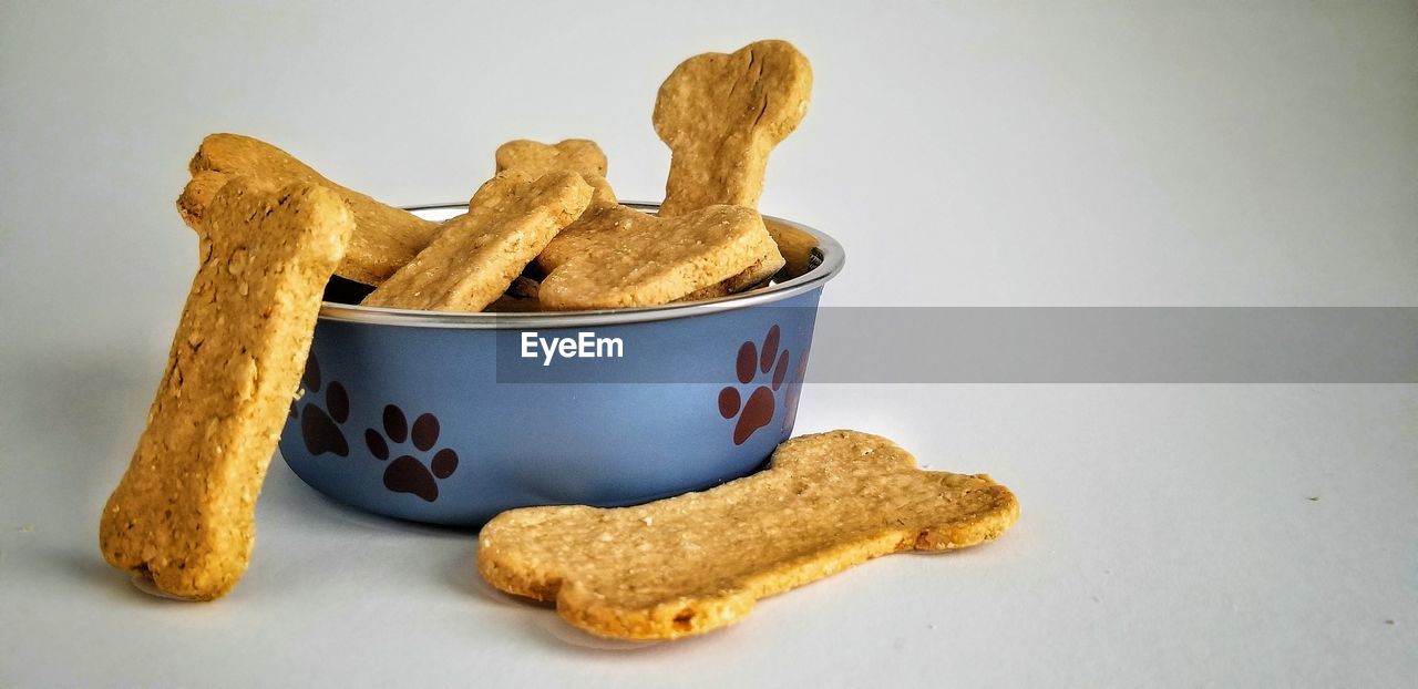 CLOSE-UP OF COOKIES ON WHITE BACKGROUND