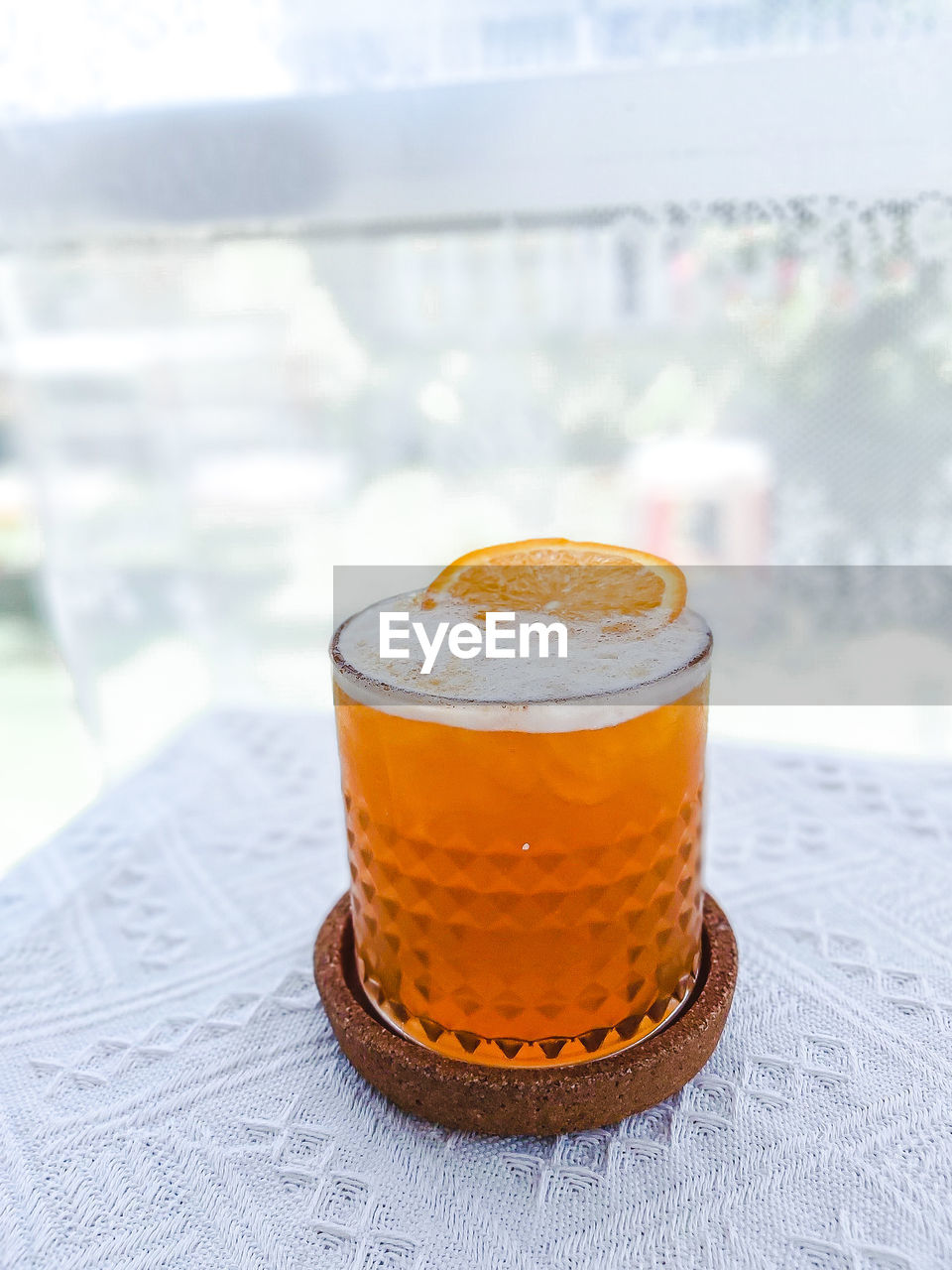 Close-up of refreshing orange drink on table