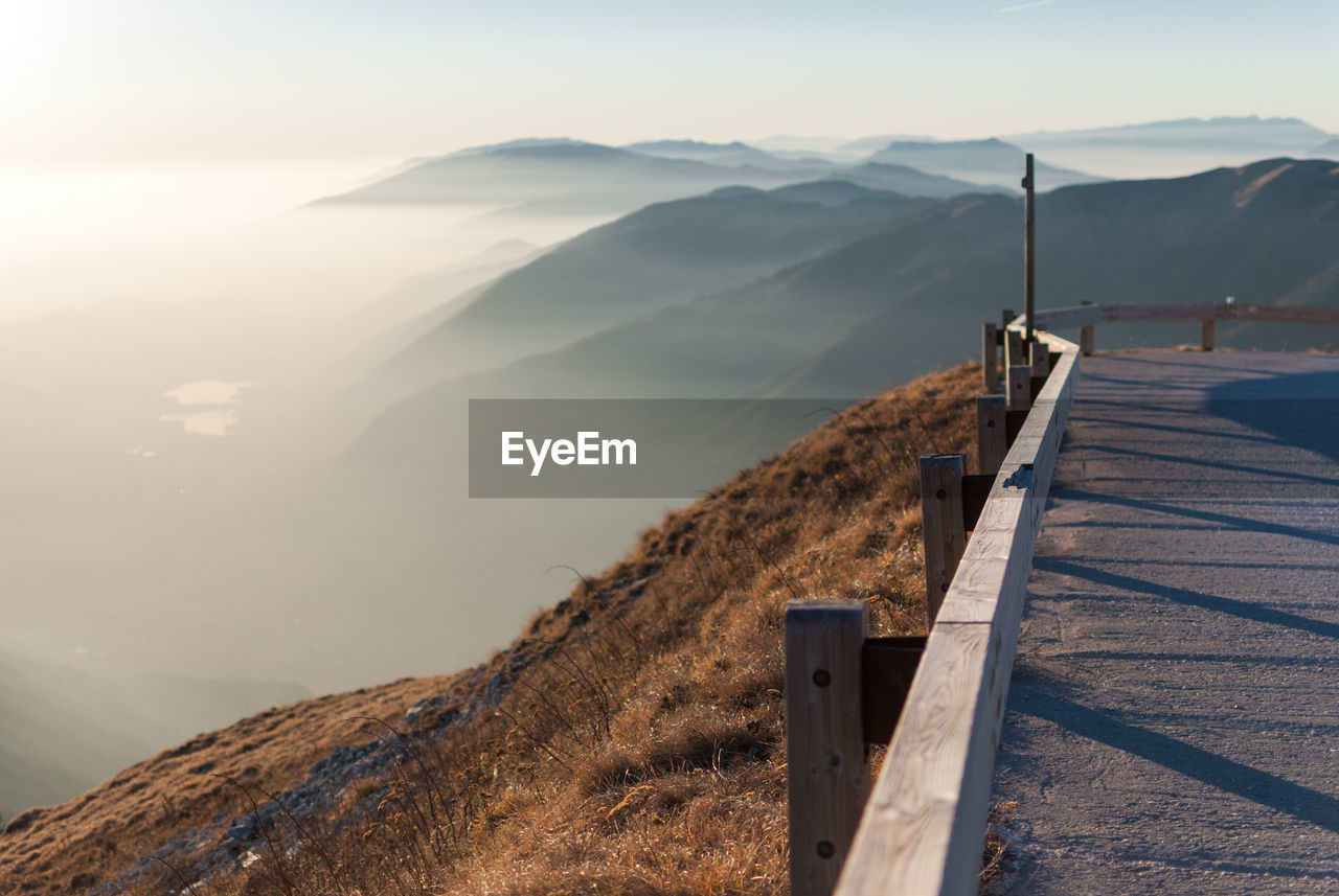 Scenic view of sea and mountains against sky