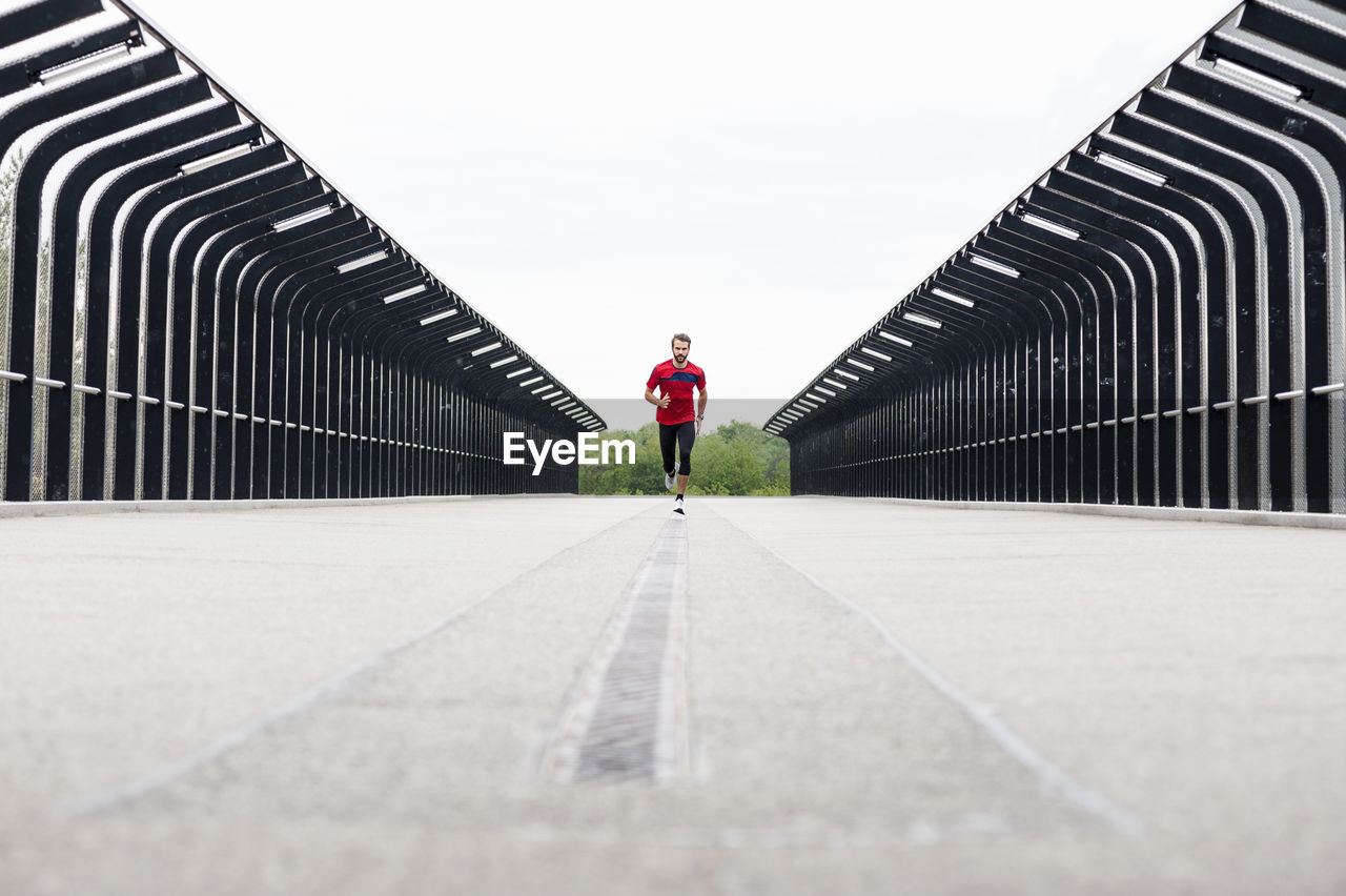 Man running on a bridge