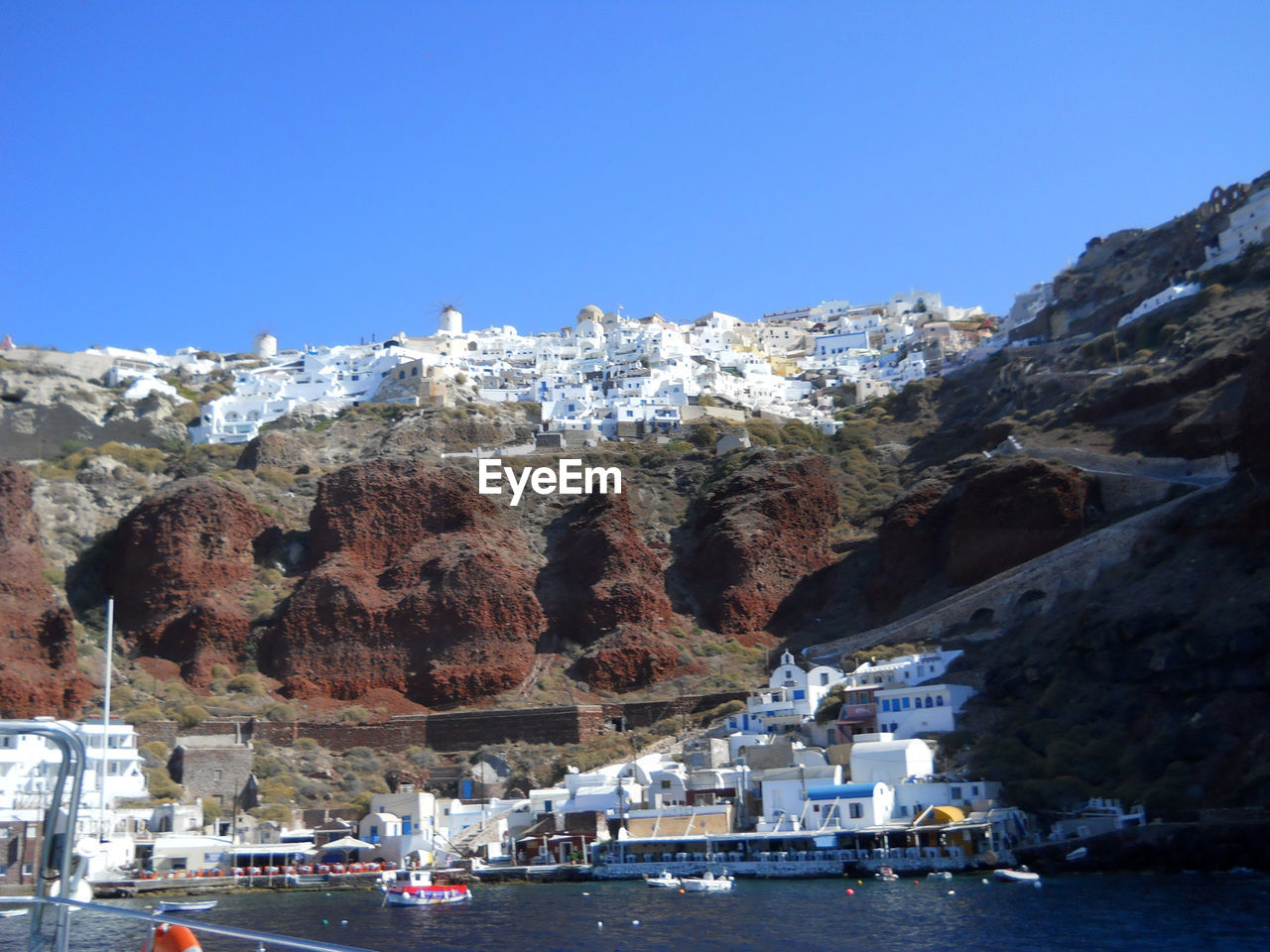 PANORAMIC VIEW OF SEA AND BUILDINGS AGAINST CLEAR SKY