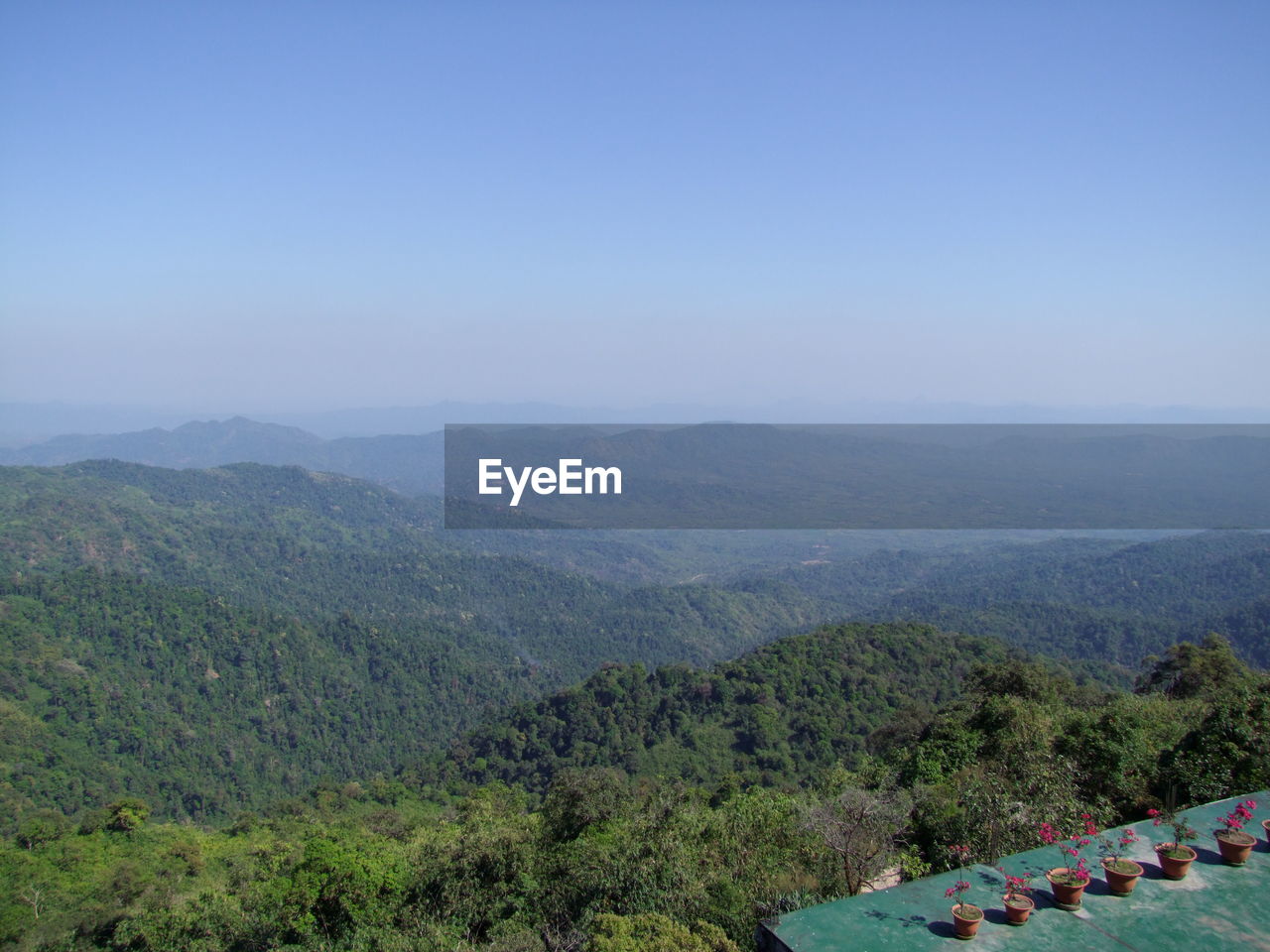 Scenic view of mountains against clear blue sky