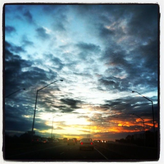 ROAD PASSING THROUGH DRAMATIC SKY