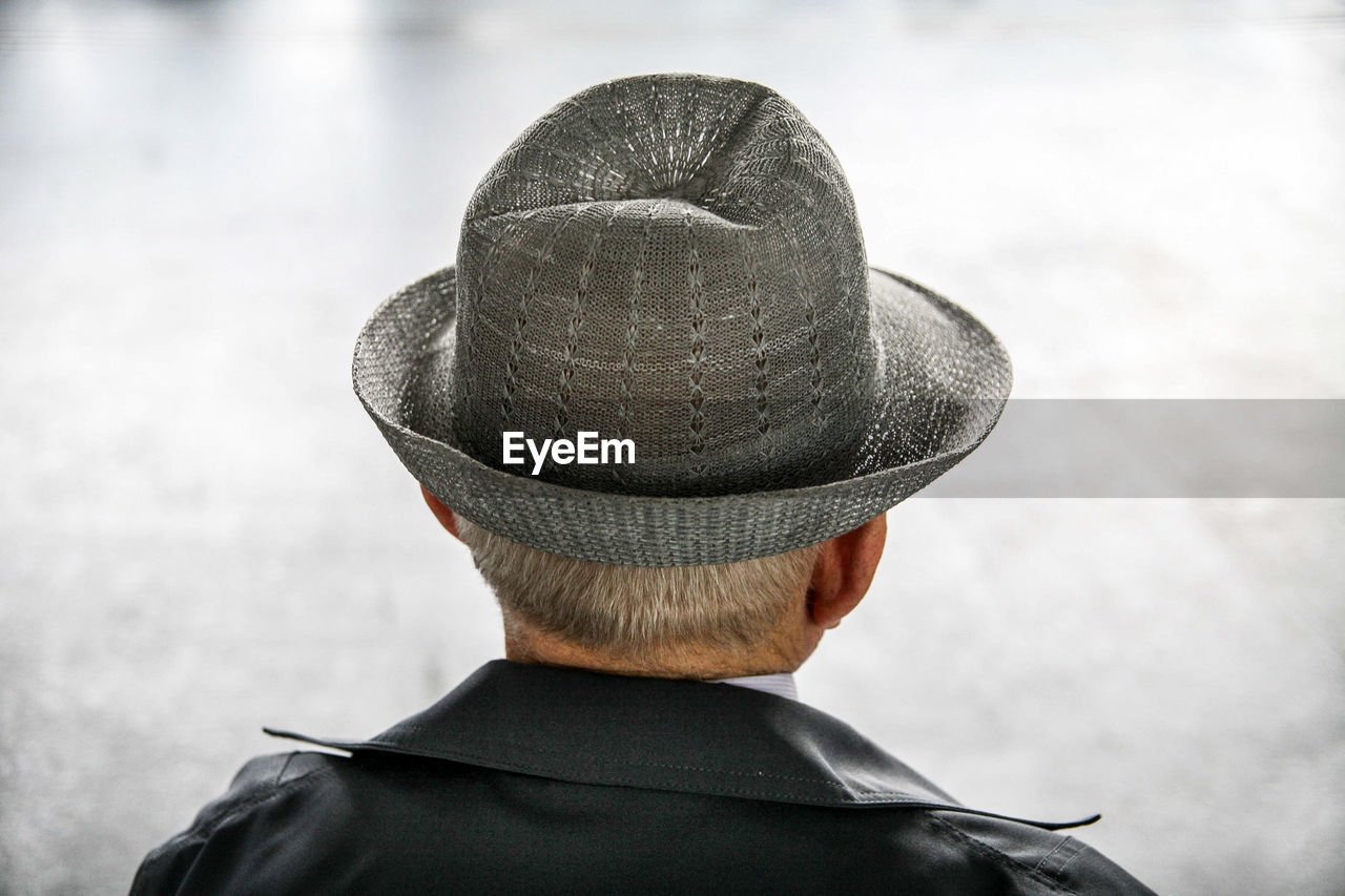 Rear view of man wearing hat