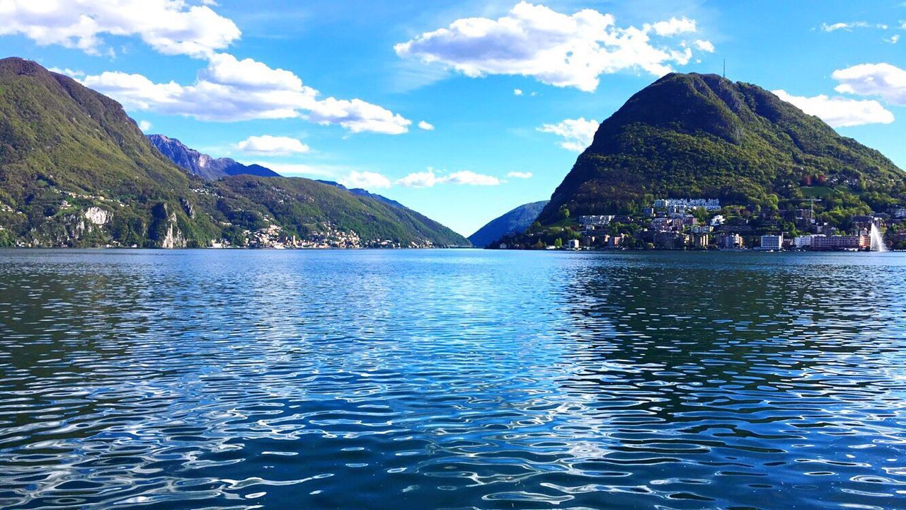 Scenic shot of calm lake against mountain range