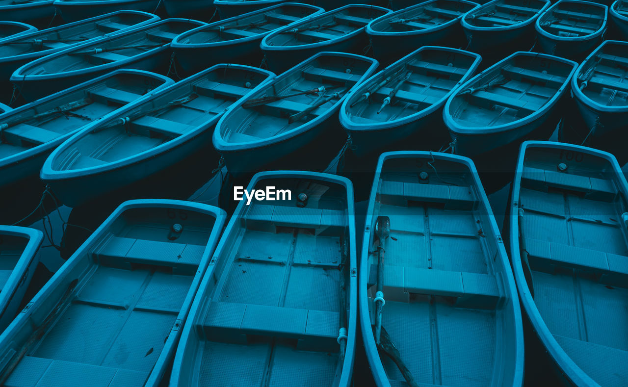 HIGH ANGLE VIEW OF EMPTY CHAIRS IN BLUE SHIP