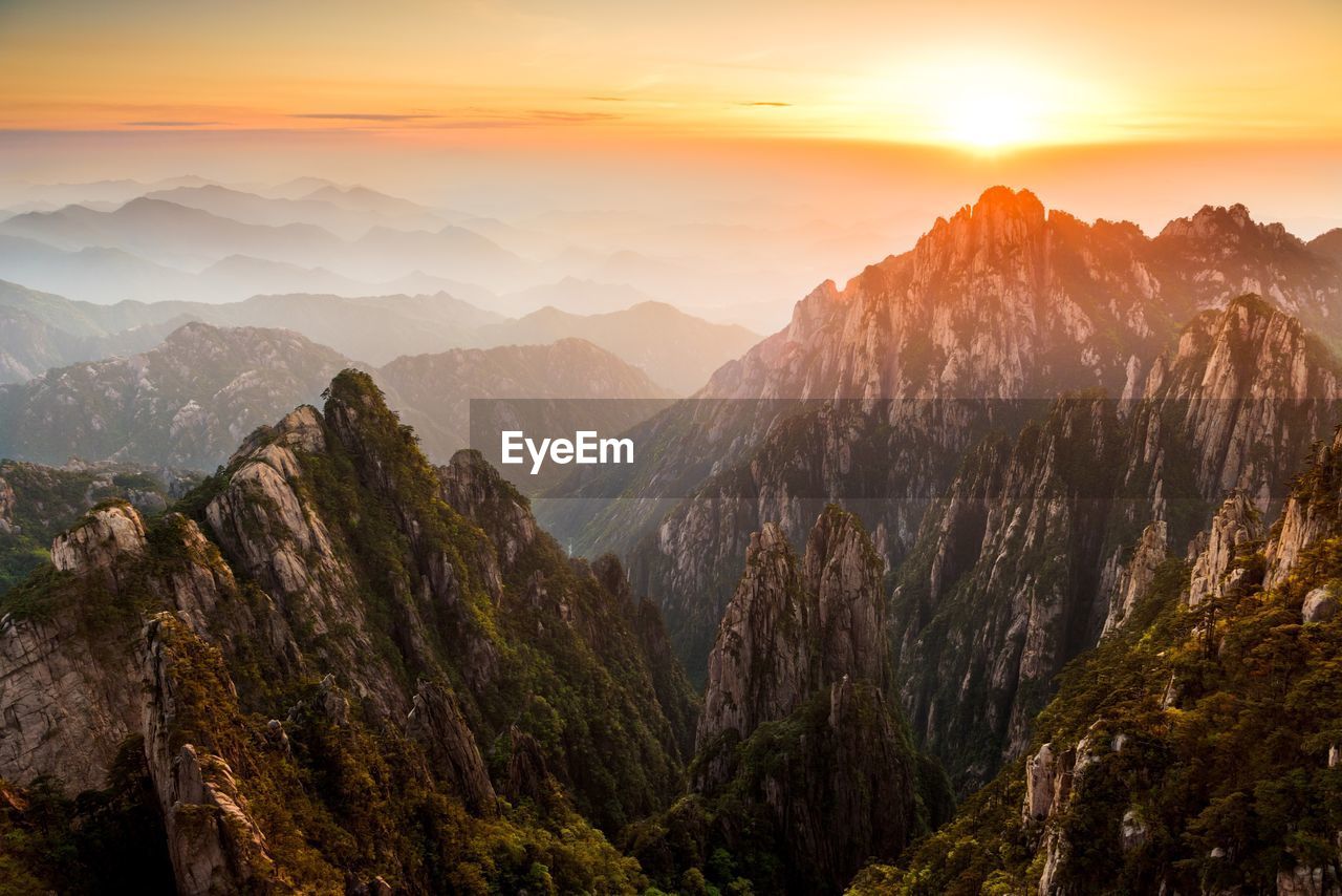 Scenic view of mountains against sky during sunset