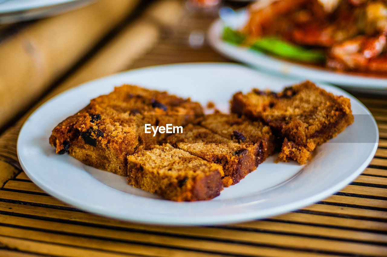 Close-up of fruitcake served on table