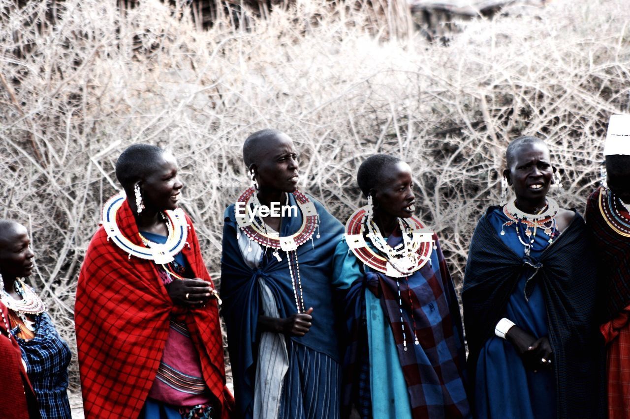 Portrait of people standing outdoors