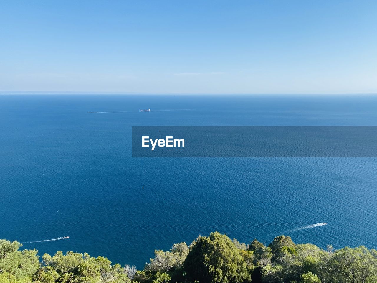 Blue sky. sea. boat. calm. nature. 