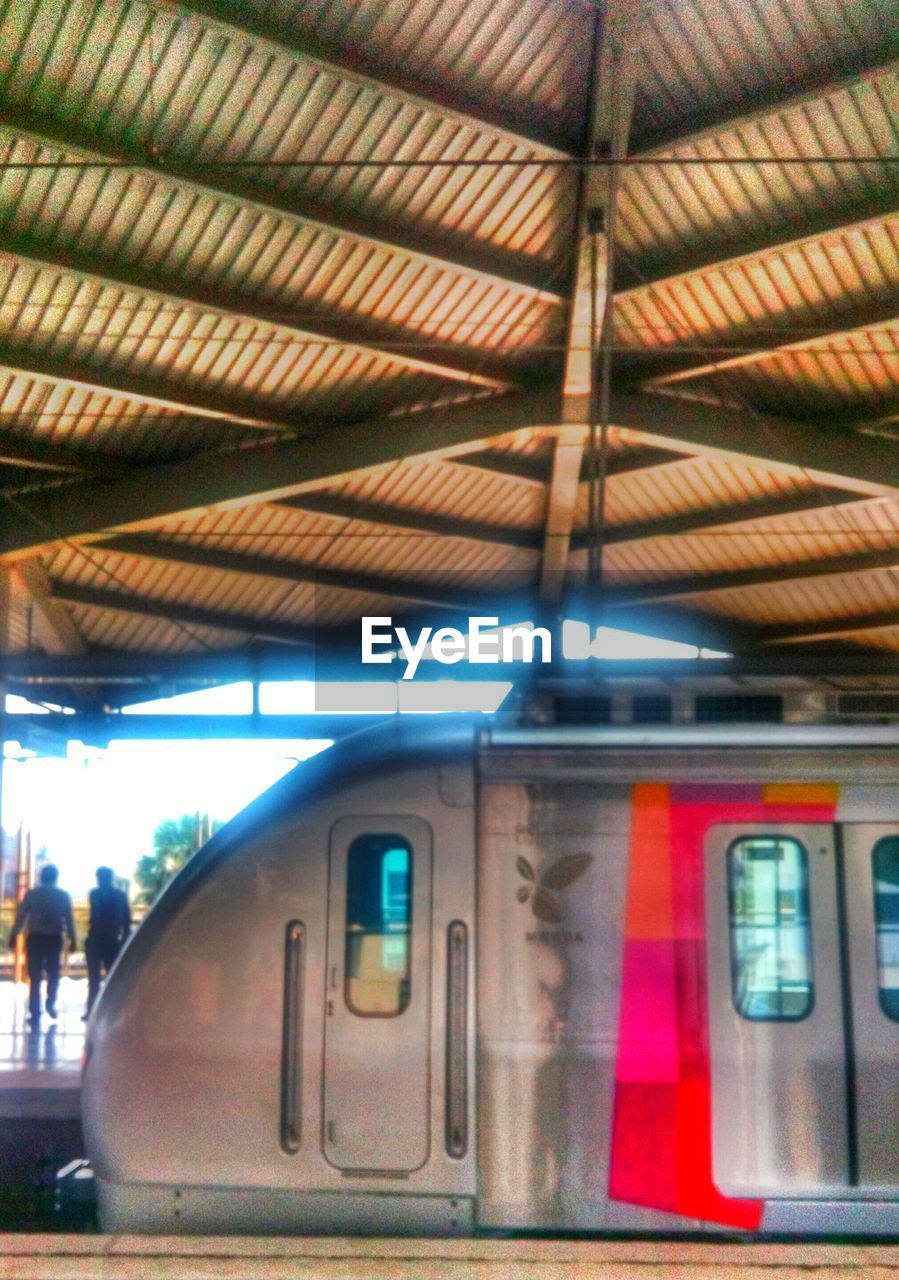 TRAIN ON RAILROAD STATION PLATFORM