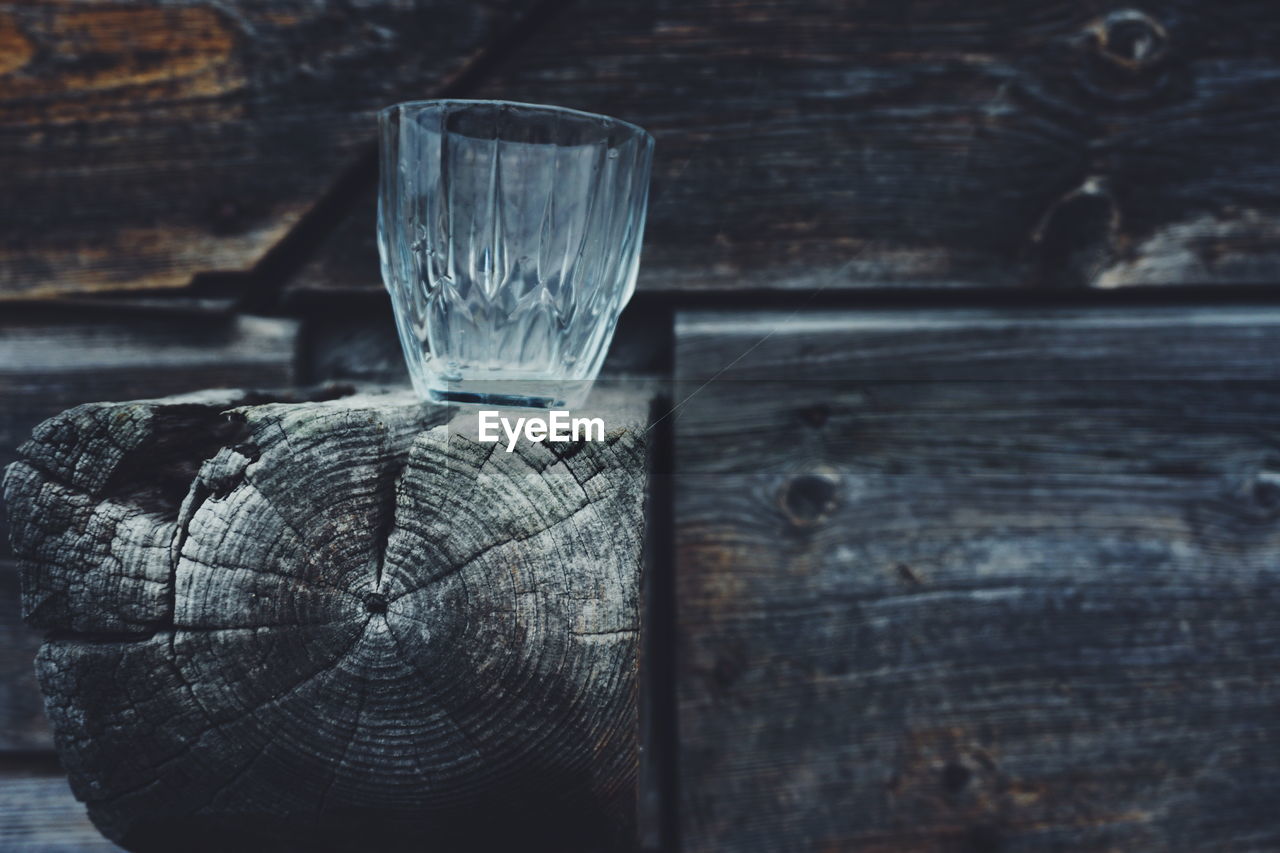 Close-up of glass on wooden table