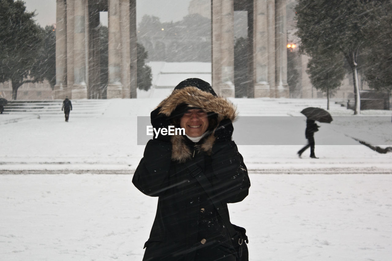 People standing on snow covered landscape