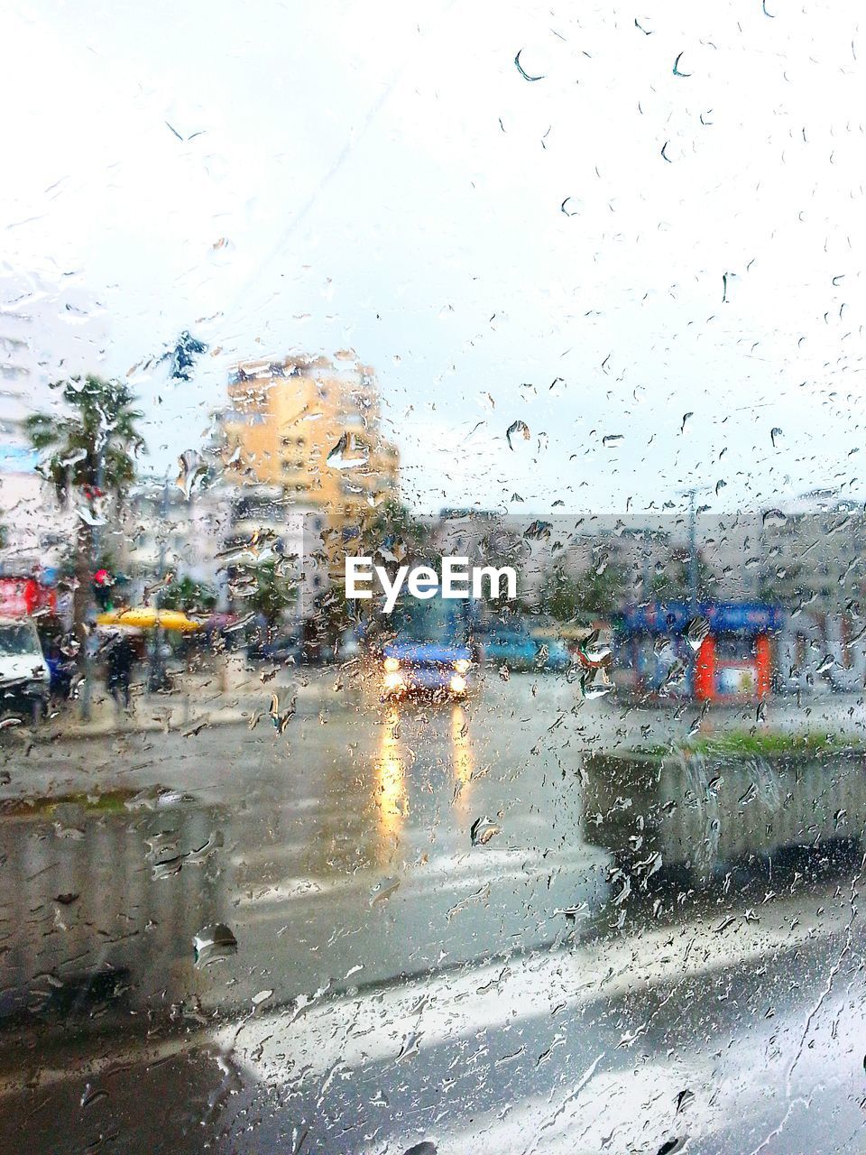 City street seen through wet window