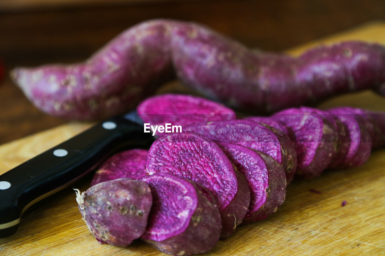 Close-up of chopped sweet potato on cutting board 