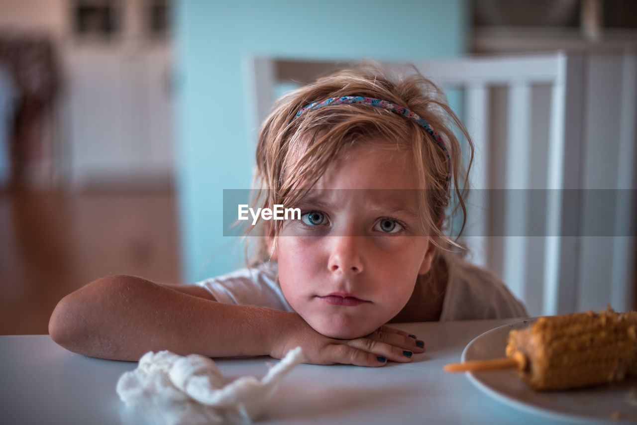 Close-up portrait of girl at home