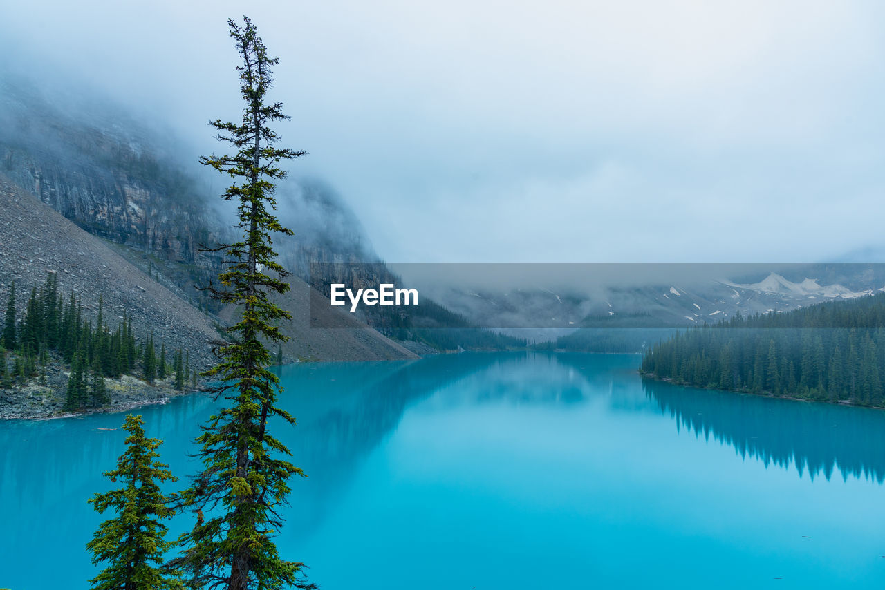 Scenic view of lake against sky during winter