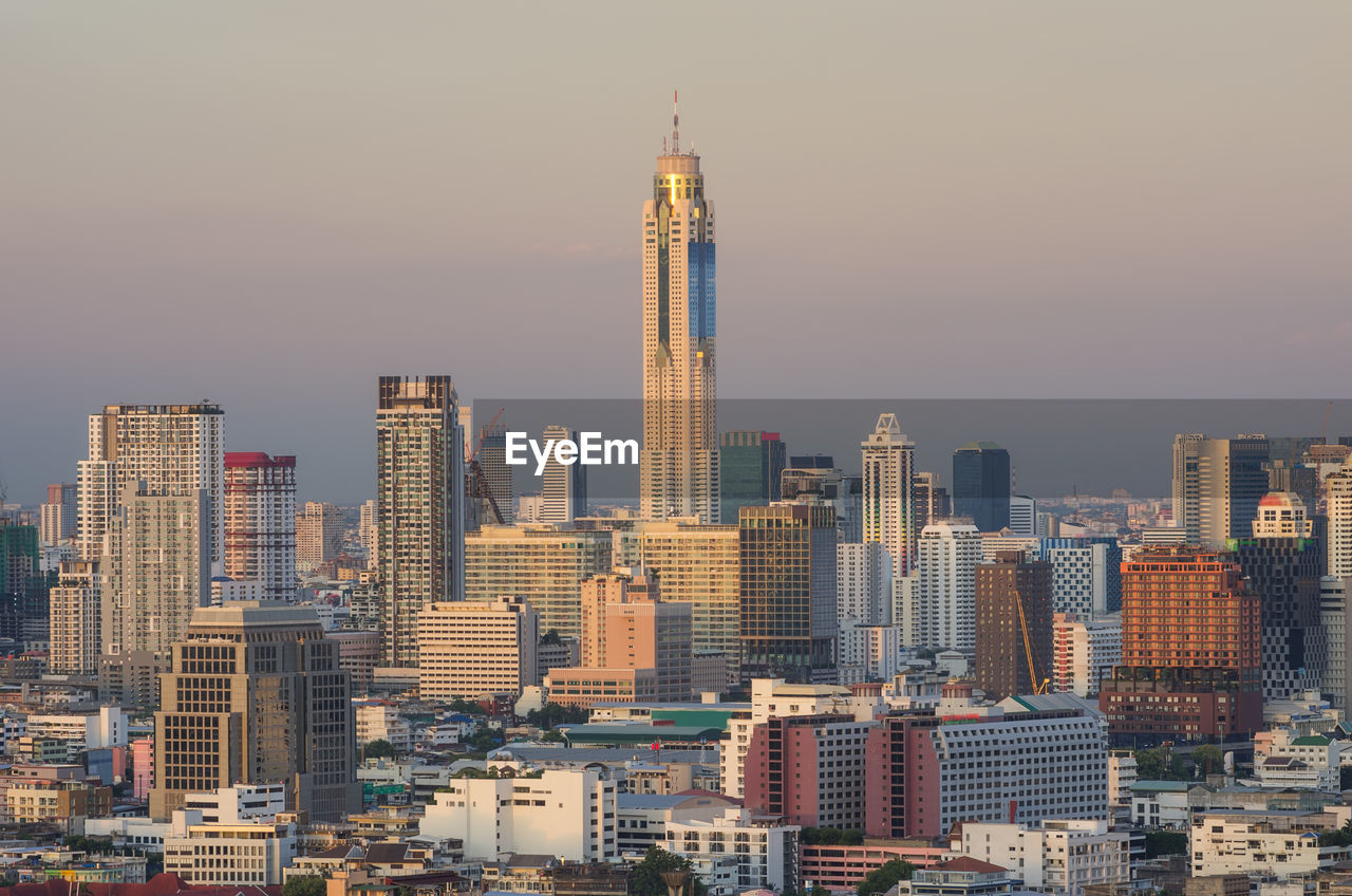 Modern buildings in city against sky