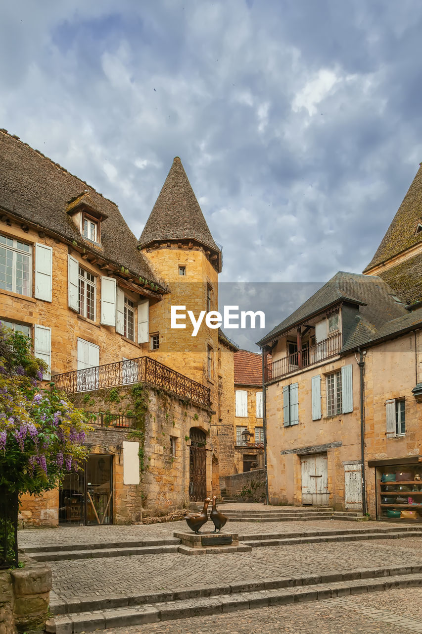 Square with famous goose statue in sarlat-la-caneda, dordogne, france