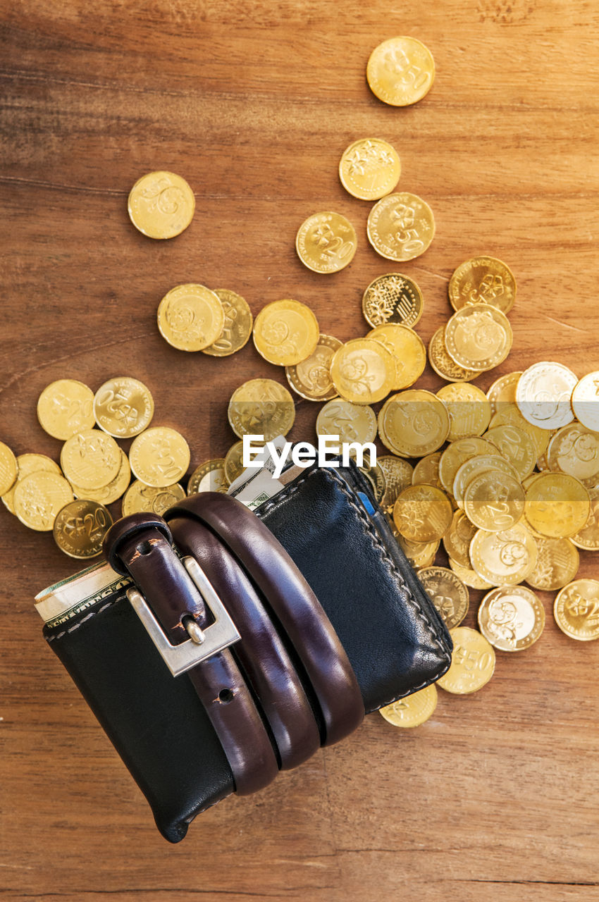 CLOSE-UP OF COINS ON TABLE